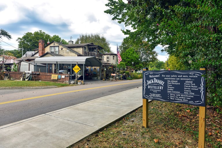 Sign by entrance to the Jack Daniel's Distillery  which offers tours of the famous distillery which was established in 1866
