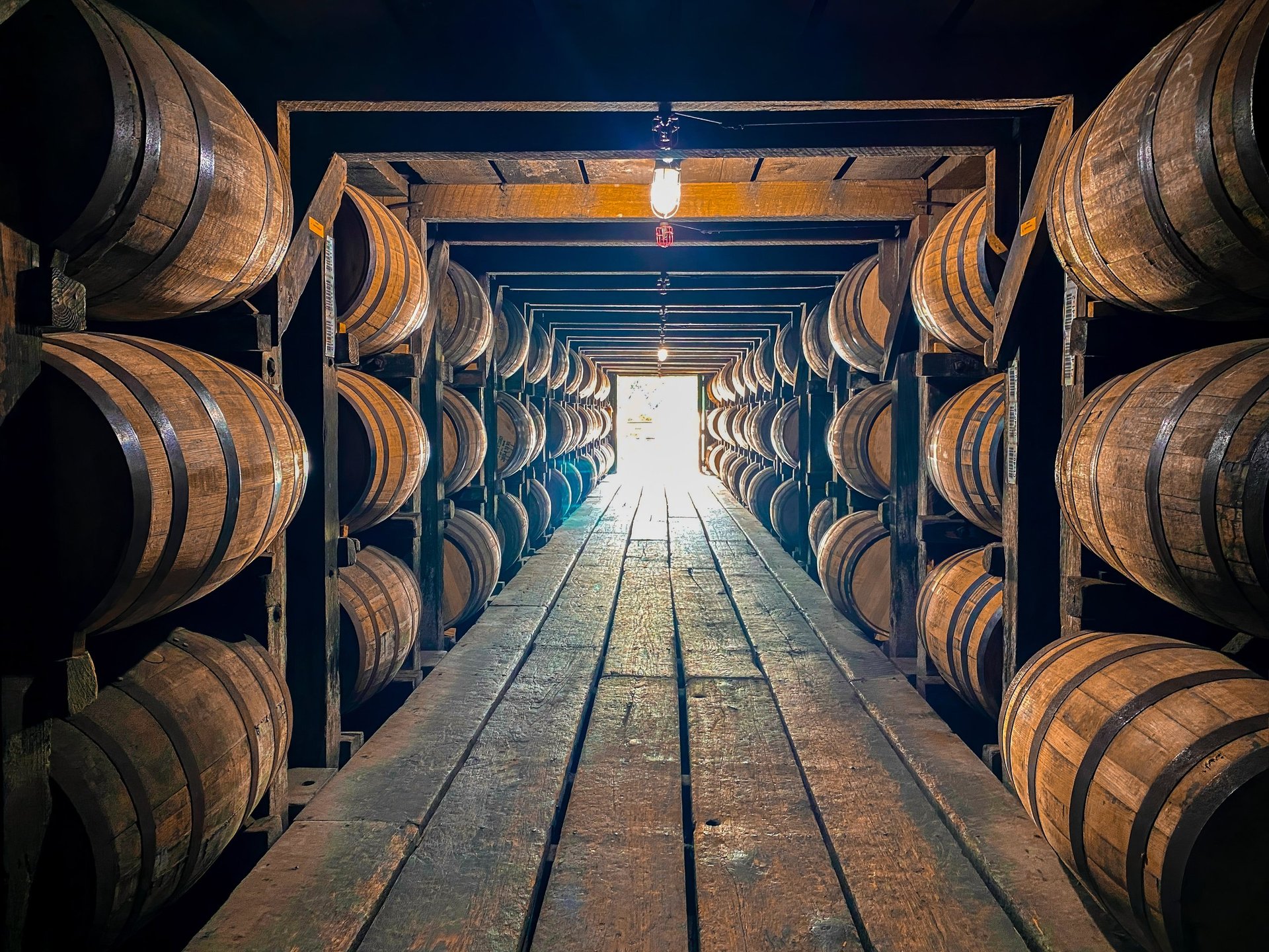 Wooden bourbon barrels stacked in Kentucky rickhouse