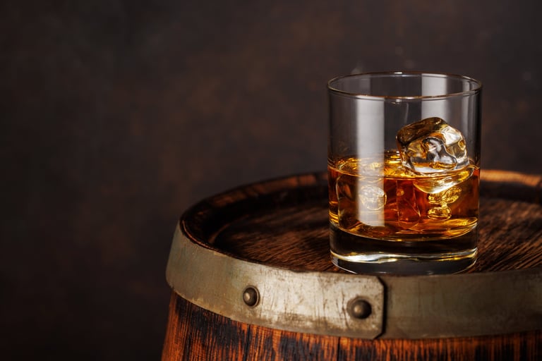 Classic whiskey glass filled with golden amber bourbon