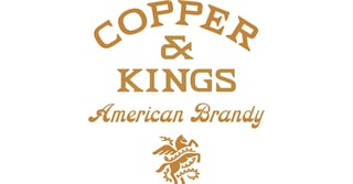 Copper and Kings American Brandy logo in gold text with decorative emblem